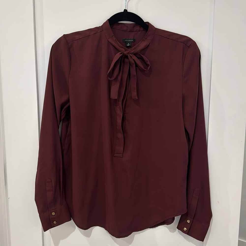 Ann Taylor maroon blouse in small with tie and button closures